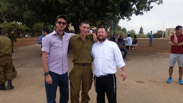 Director Rabbi Ben Packer with "lone soldiers"