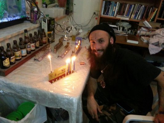Our "lone soldiers" and guests celebrating Hanukkah