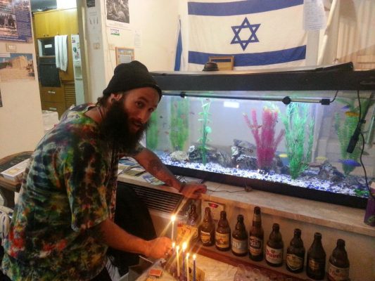 Our "lone soldiers" and guests celebrating Hanukkah