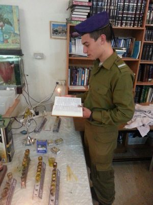 Our "lone soldiers" and guests celebrating Hanukkah
